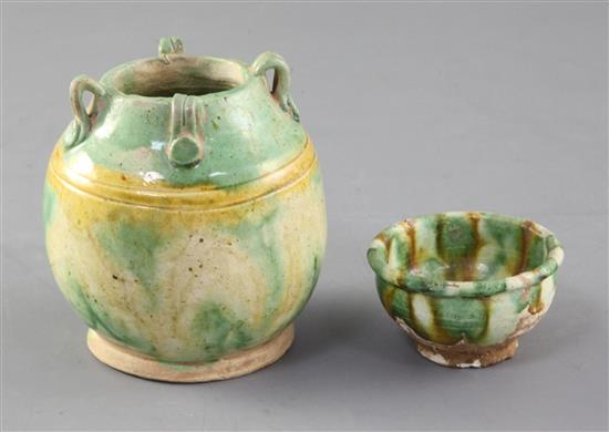 A Chinese Sancai four handled jar and a similar cup, Tang dynasty (618-906AD), height 8.5cm. and 3.1cm.